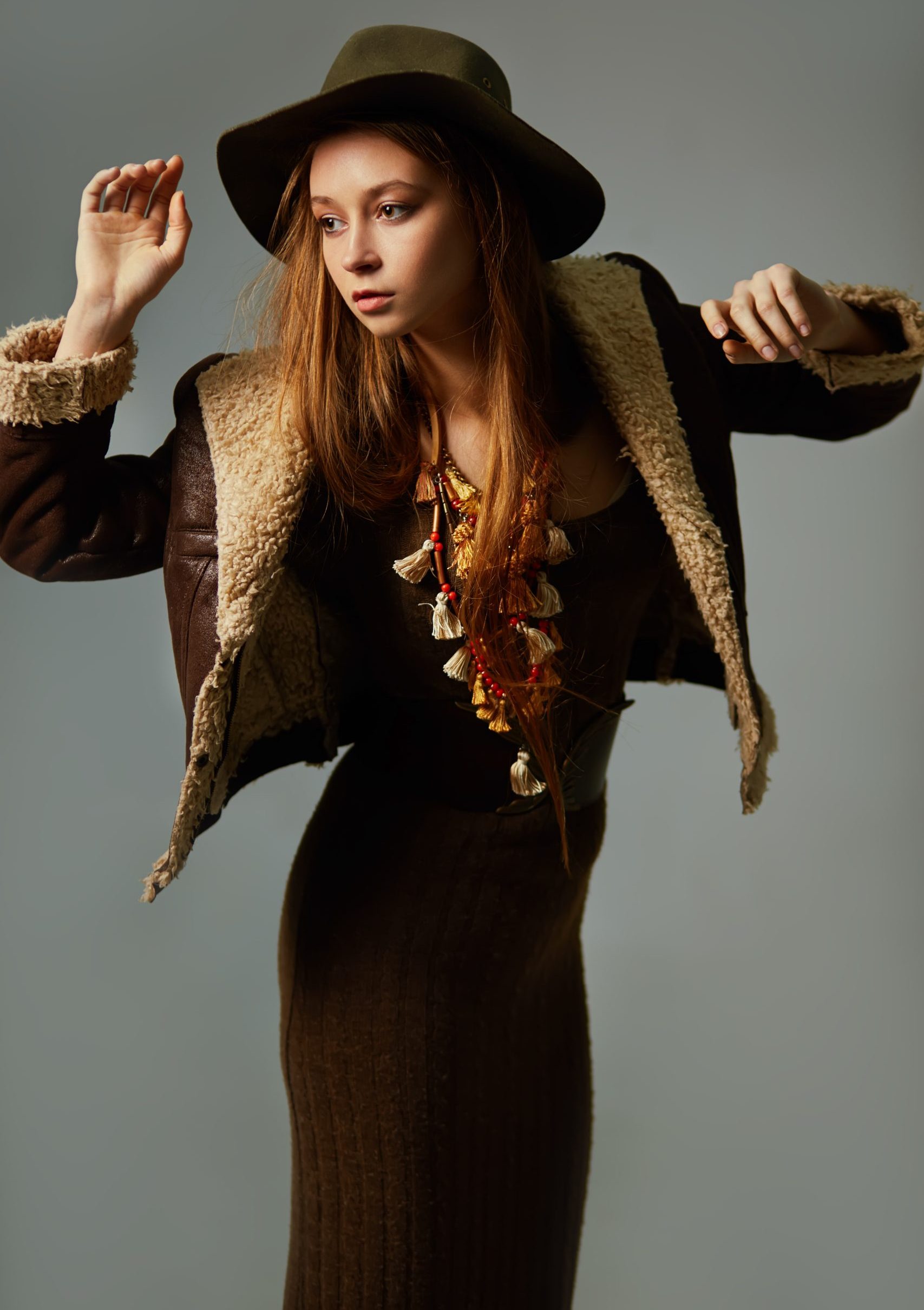 model posing with warm clothing and unique necklac 2026 03 19 21 52 54 utc