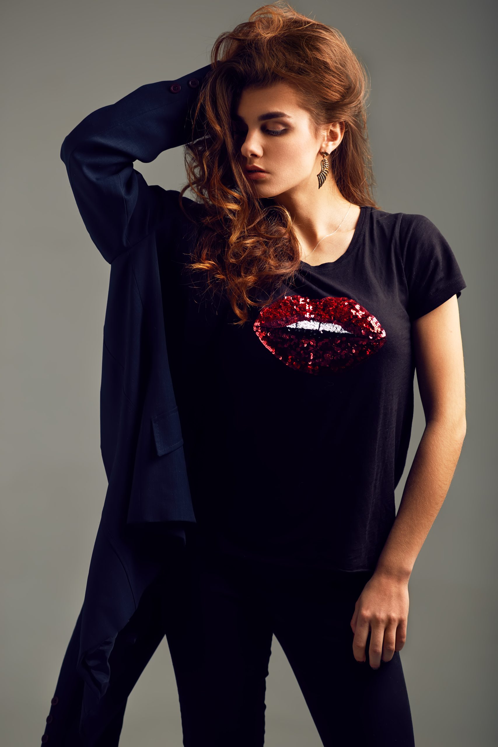 stylish woman with red lips graphic posing in stud 2026 03 20 04 47 12 utc