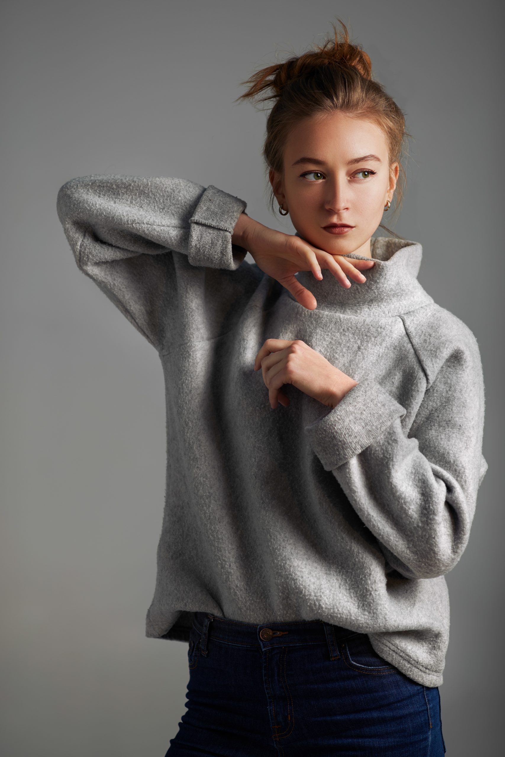woman with hair up wearing gray pullover 2026 03 20 00 20 54 utc